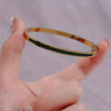 RIGIDE ZIRCONIA GREEN SQUARE EN CHANNEL BRACELET | GOLD JEWELLERY