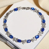 TENNIS STONES OVAL SAPPHIRE BLUE TWIST PAVÉ BRACELET | SILVER JEWELLERY