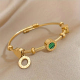 CABLE TWISTED CHARM MALACHITE AND NUMERAL ROMAN BRACELET | GOLD JEWELLERY