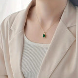 NECKLACE EMERALD RECTANGULAR HALO PAVÉ PENDANT | GOLD JEWELLERY