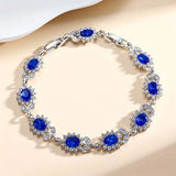 TENNIS FLOWER OVAL SAPPHIRE BLUE HALO PAVÉ BRACELET | SILVER JEWELLERY