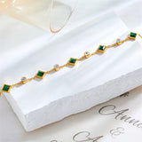 CHAIN CHARM EMERALD SQUARE AND ZIRCONIA ALTERNATING BRACELET | GOLD JEWELLERY